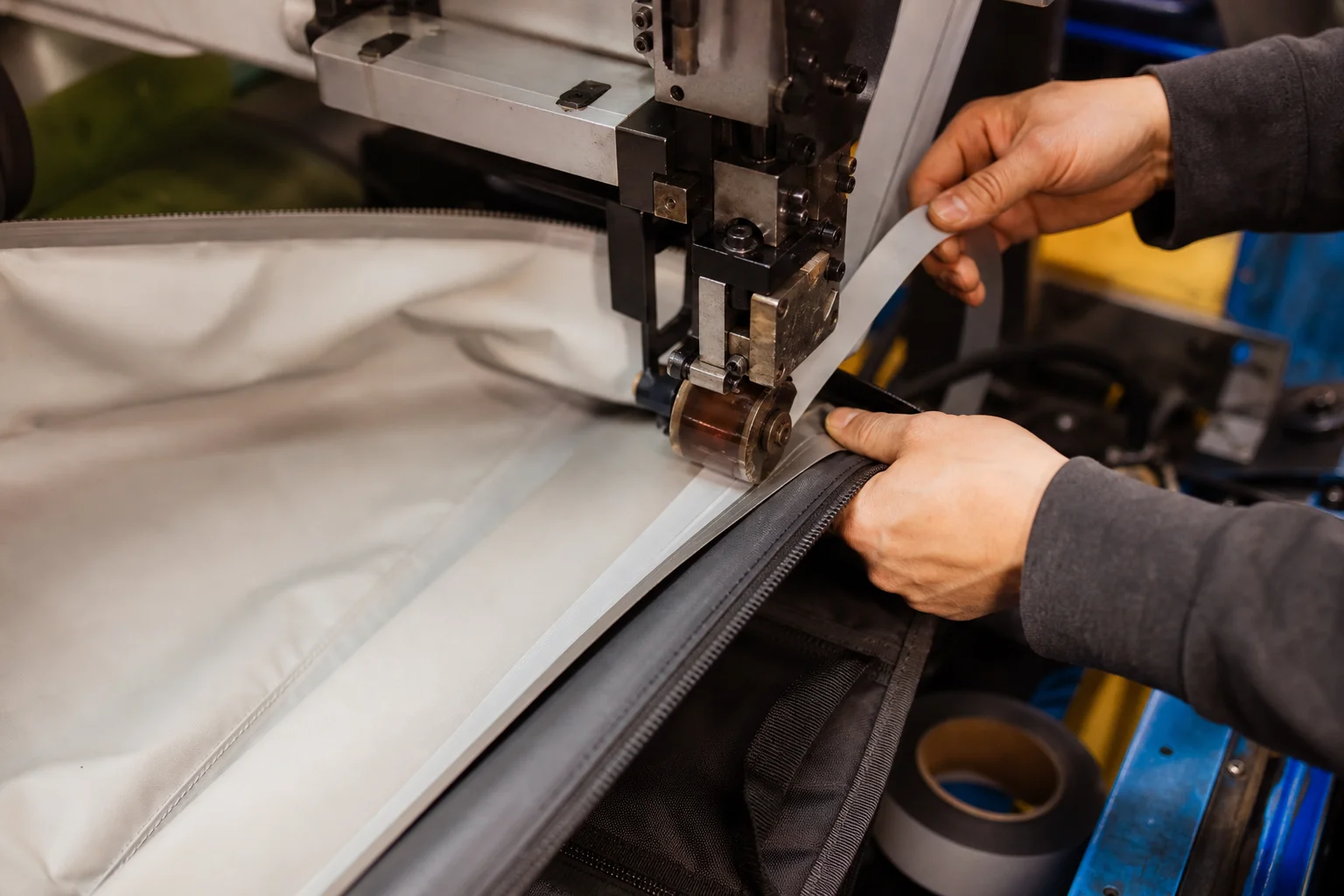 Heat-sealed seam sealing tape applied to a bag seam