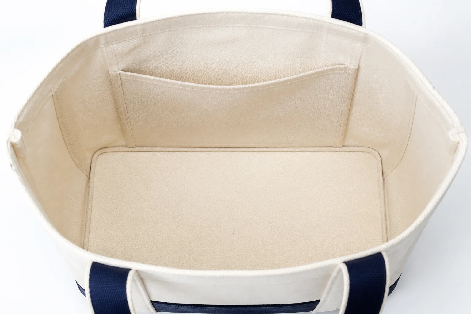 Tote bag interior with lining, slip pocket and reinforced base board
