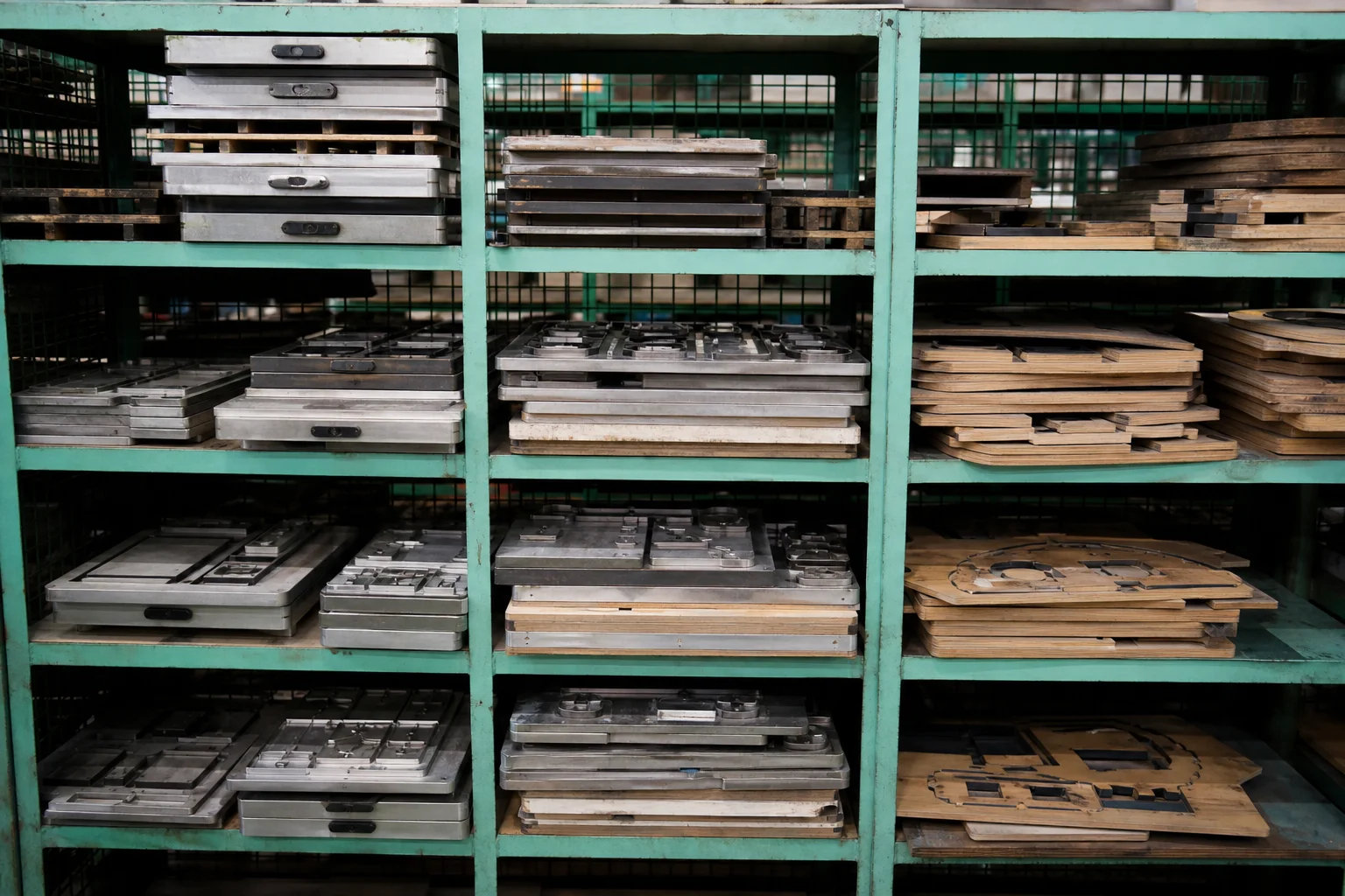 Tooling store rack holding cutting dies, embossing plates and sewing templates in a bag factory